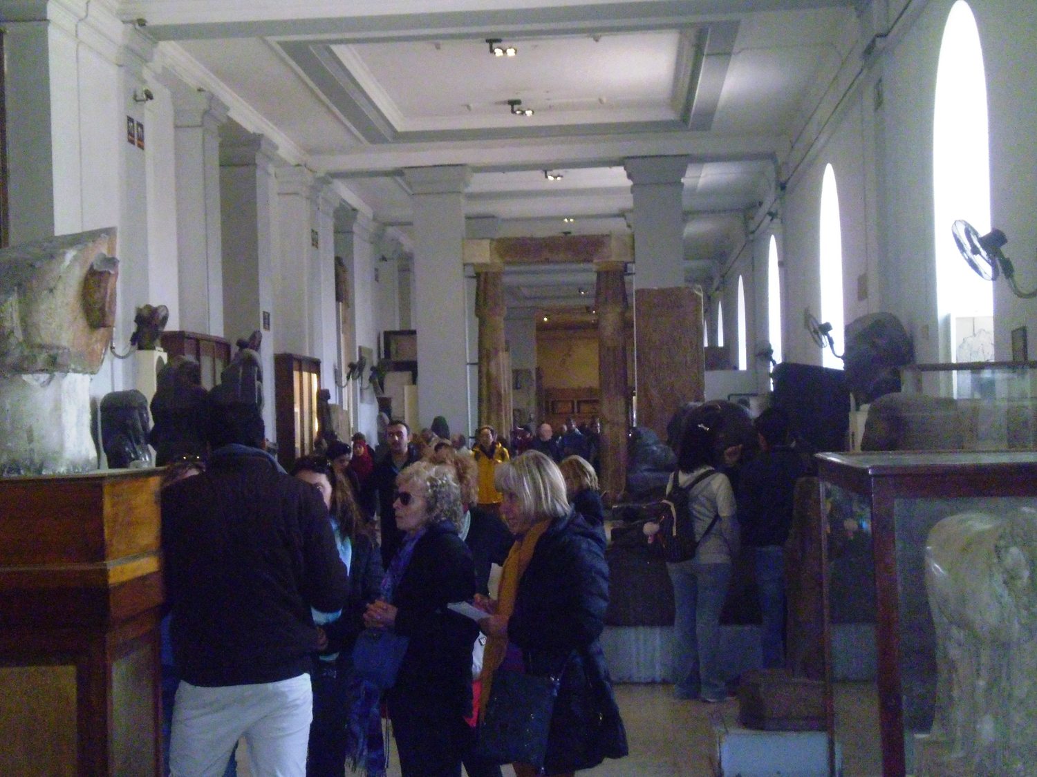 Groups of sculpture displayed near one another in the Egyptian Museum in Cairo